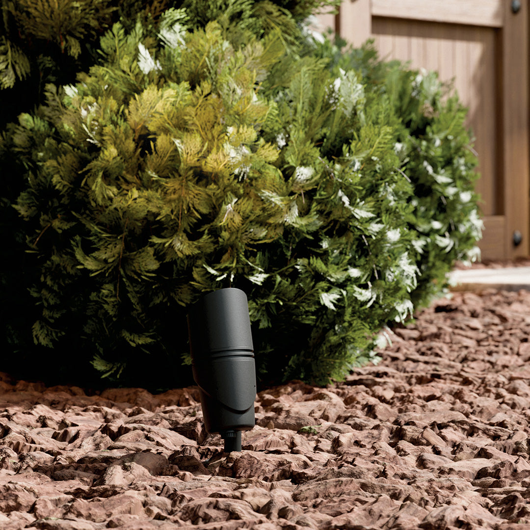 KICHLER Varia 16312 19.6W LED Large Accent Light Selectable CCT Textured Black installed in landscape, daytime