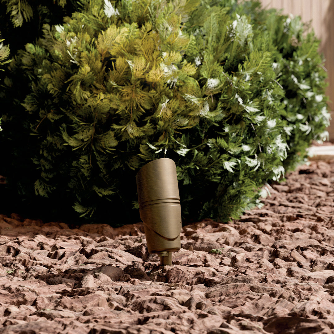 KICHLER Varia 16312 19.6W LED Large Accent Light Selectable CCT Centennial Brass installed in landscape, daytime