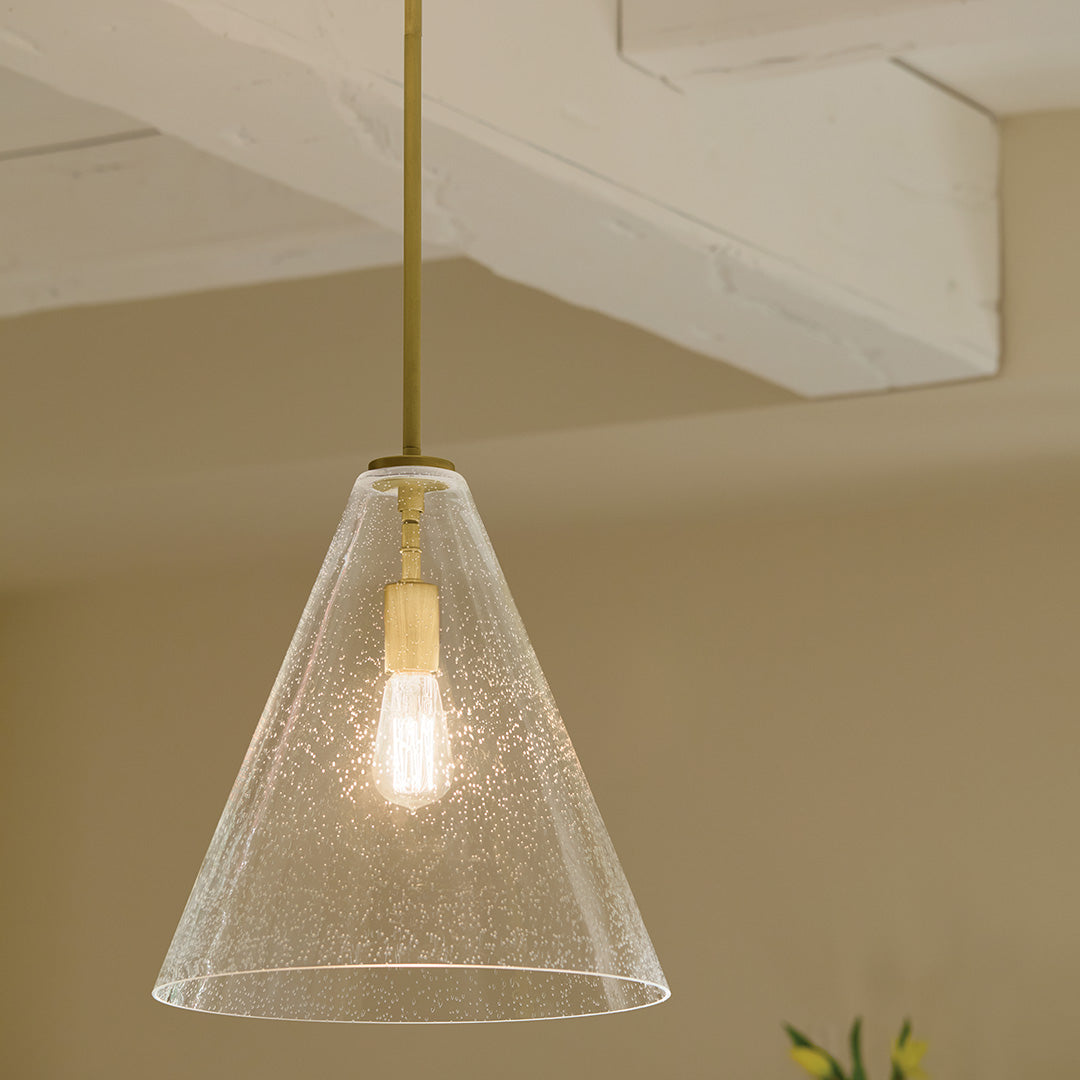 Kitchen featuring the Everly 15.5" 1-Light Cone Pendant with Clear Seeded Glass in Natural Brass