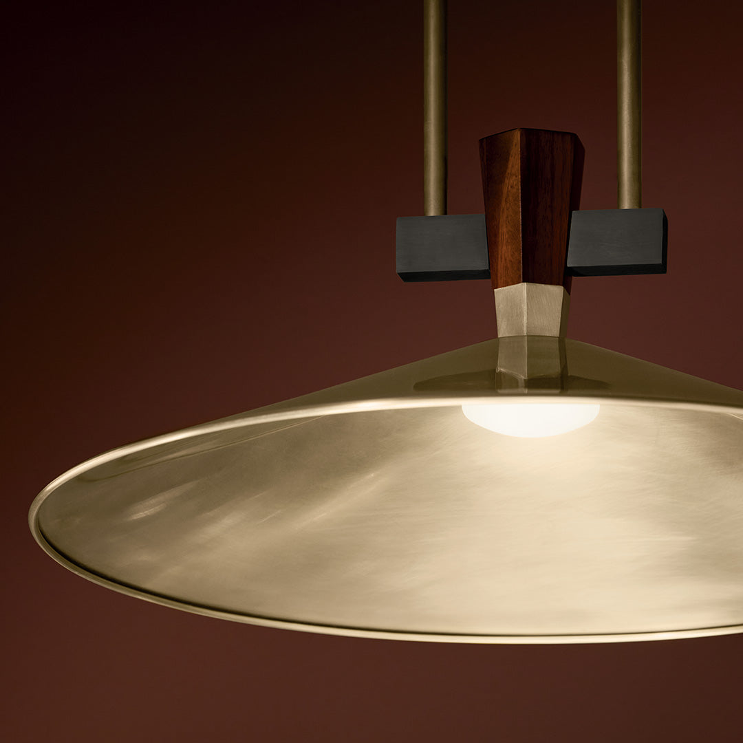 The Tenon 20" LED Pendant in Champagne Bronze hung in a bar