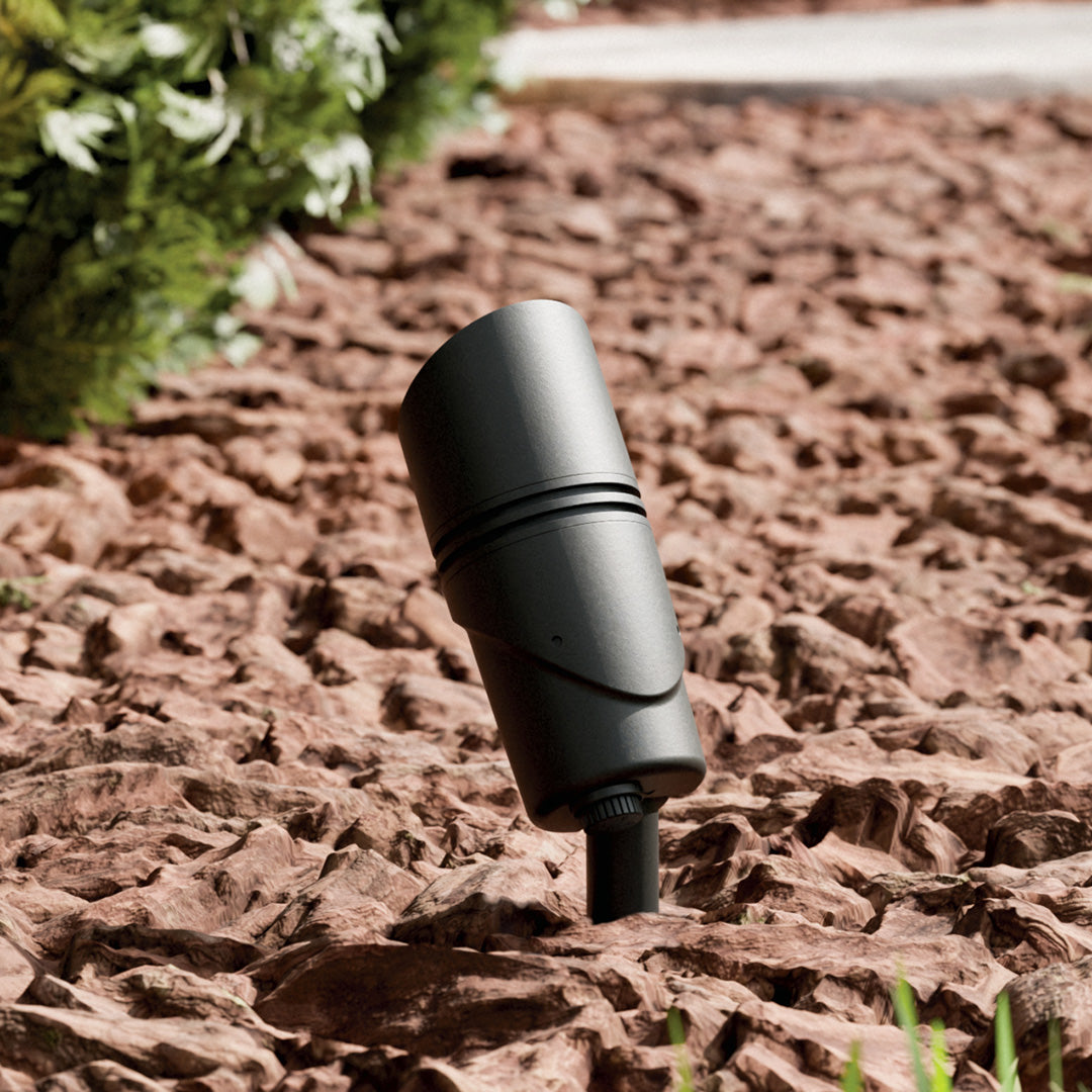 KICHLER Varia 16311 9.8W LED Medium Accent Light Selectable CCT Textured Black installed in landscape, daytime