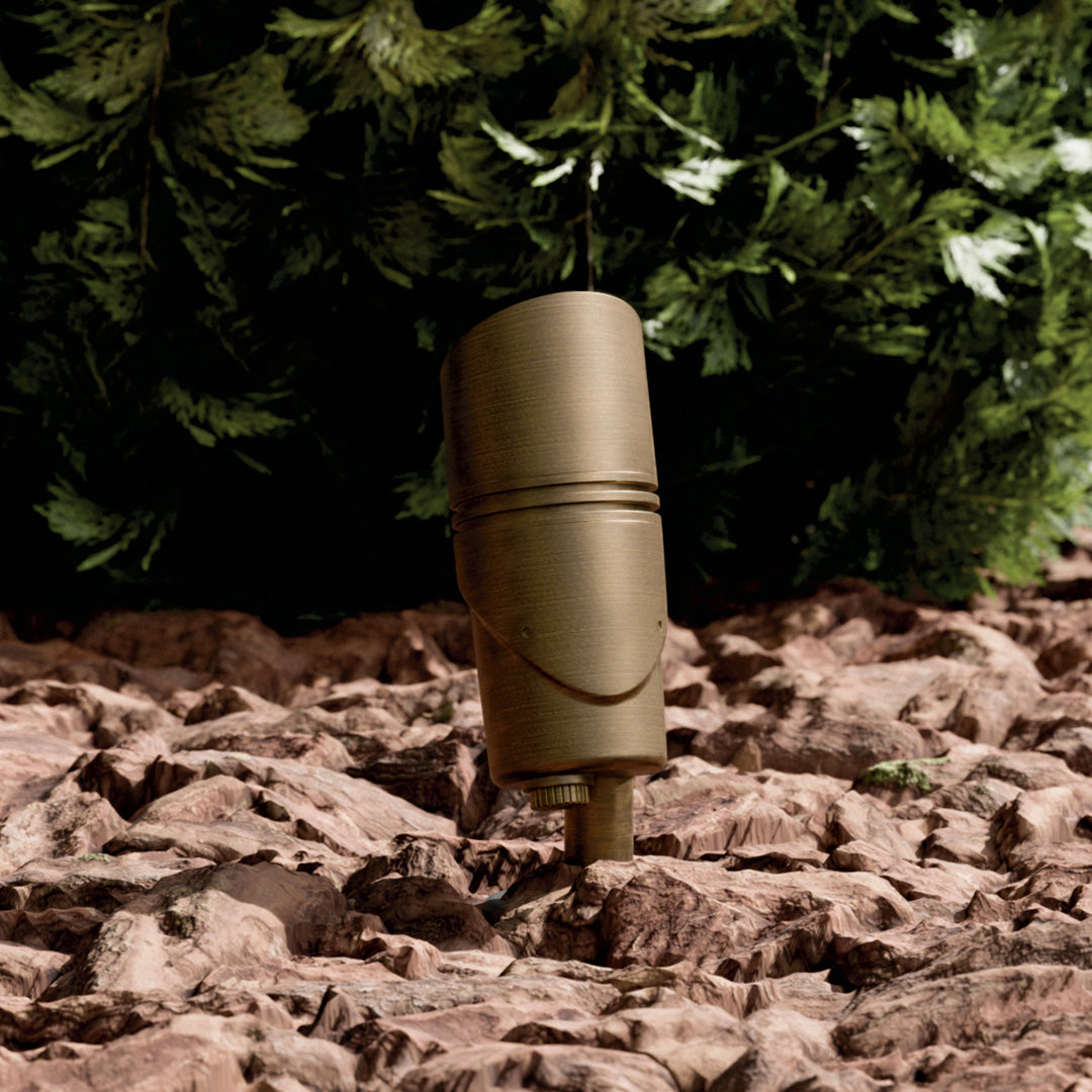 KICHLER Varia 16311 9.8W LED Medium Accent Light Selectable CCT Centennial Brass installed in landscape, daytime