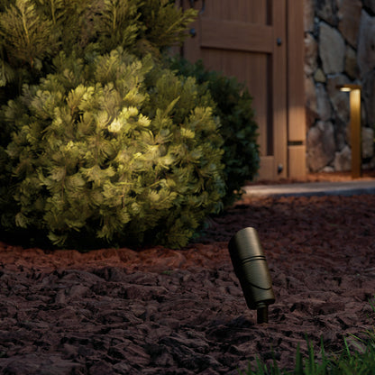 KICHLER Varia 16311 9.8W LED Medium Accent Light Selectable CCT Centennial Brass lit at night in landscape