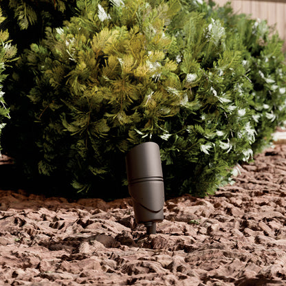 KICHLER Varia 16312 19.6W LED Large Accent Light Selectable CCT Textured Architectural Bronze installed in landscape, daytime