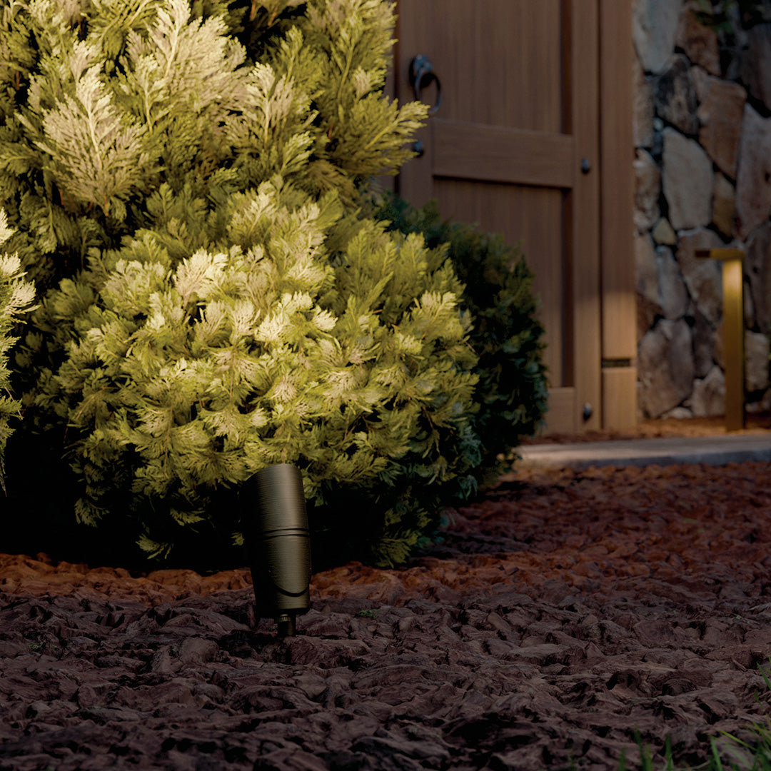 KICHLER Varia 16312 19.6W LED Large Accent Light Selectable CCT Centennial Brass lit at night in landscape