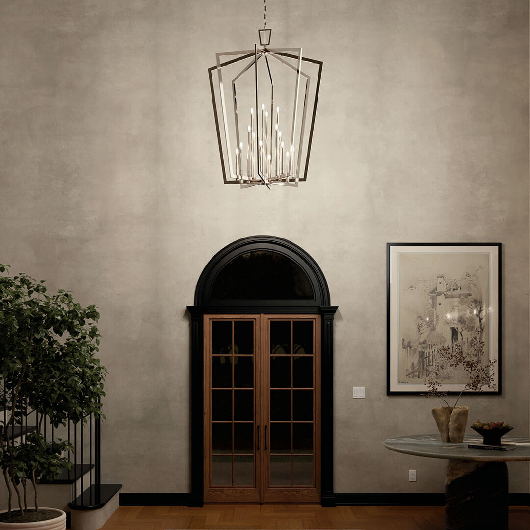 Foyer at night with the Abbotswell 49 Inch 16 Light Foyer Pendant in Polished Nickel