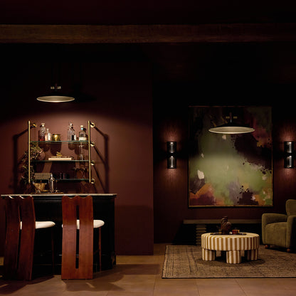 Bar at night featuring the Tenon 20" 1-Light LED Pendant in Black