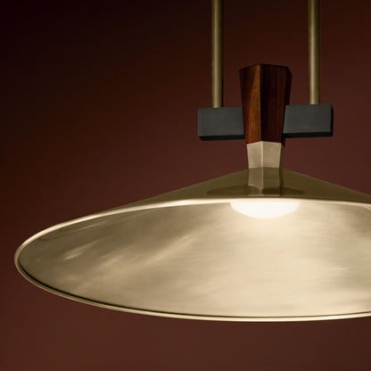 The Tenon 20"  LED Pendant in Champagne Bronze hung in a bar